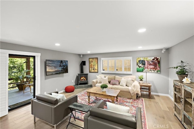 33942 Pequito Dr, Dana Point, CA 92629 - living room featuring recessed lighting, light wood finished floors, and a wood stove