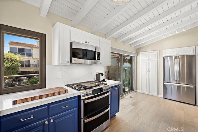 33942 Pequito Dr, Dana Point, CA 92629 - kitchen featuring appliances with stainless steel finishes, blue cabinetry, light wood-type flooring, backsplash, and light countertops