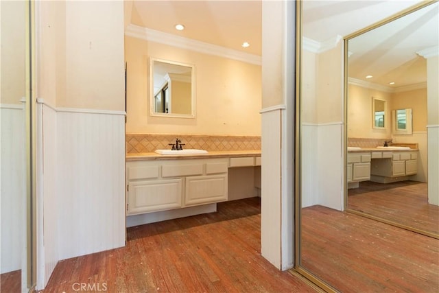27021 Moro Azul, Mission Viejo, CA 92691 - bathroom featuring ornamental molding, a wainscoted wall, wood finished floors, vanity, and recessed lighting