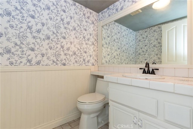 27021 Moro Azul, Mission Viejo, CA 92691 - bathroom with wallpapered walls, wainscoting, and vanity