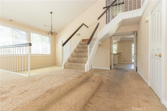 27021 Moro Azul, Mission Viejo, CA 92691 - staircase with carpet floors and a chandelier