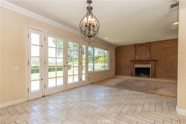27021 Moro Azul, Mission Viejo, CA 92691 - unfurnished living room with a chandelier, french doors, a large fireplace, ornamental molding, and recessed lighting