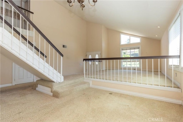 27021 Moro Azul, Mission Viejo, CA 92691 - stairs featuring carpet floors, vaulted ceiling, and a chandelier
