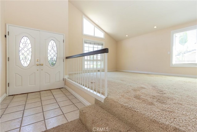 27021 Moro Azul, Mission Viejo, CA 92691 - foyer featuring high vaulted ceiling and carpet floors