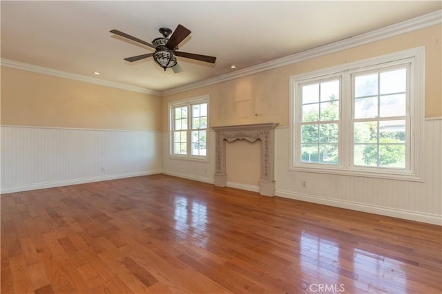 27021 Moro Azul, Mission Viejo, CA 92691 - unfurnished living room with wood finished floors, a ceiling fan, wainscoting, and crown molding