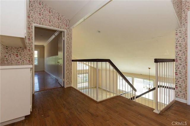 27021 Moro Azul, Mission Viejo, CA 92691 - stairway with wallpapered walls, vaulted ceiling, a wainscoted wall, and wood-type flooring
