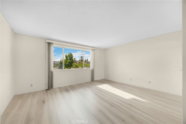 4510 E Hightree Cir, Anaheim, CA 92807 - spare room featuring wood finished floors and a textured ceiling