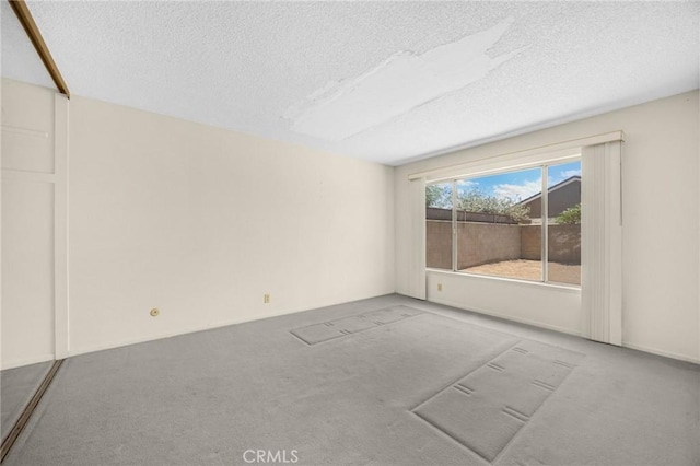 4510 E Hightree Cir, Anaheim, CA 92807 - carpeted empty room featuring a textured ceiling