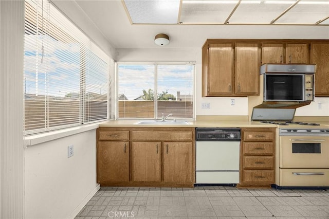 4510 E Hightree Cir, Anaheim, CA 92807 - kitchen featuring white appliances, light countertops, brown cabinetry, and light flooring