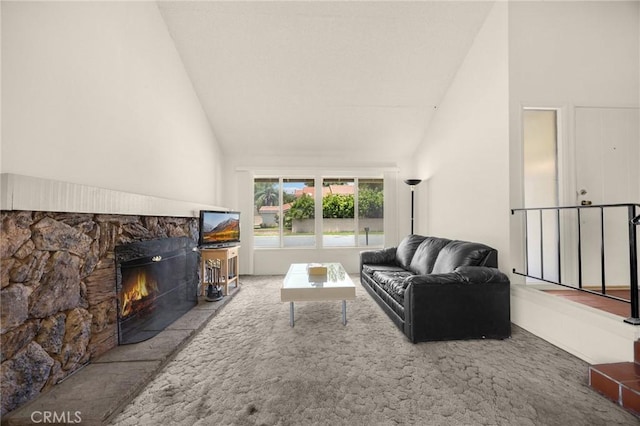 4510 E Hightree Cir, Anaheim, CA 92807 - living room with high vaulted ceiling, a stone fireplace, and carpet flooring