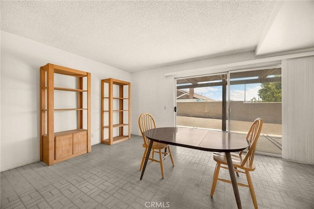 4510 E Hightree Cir, Anaheim, CA 92807 - dining space featuring brick patterned floors and a textured ceiling
