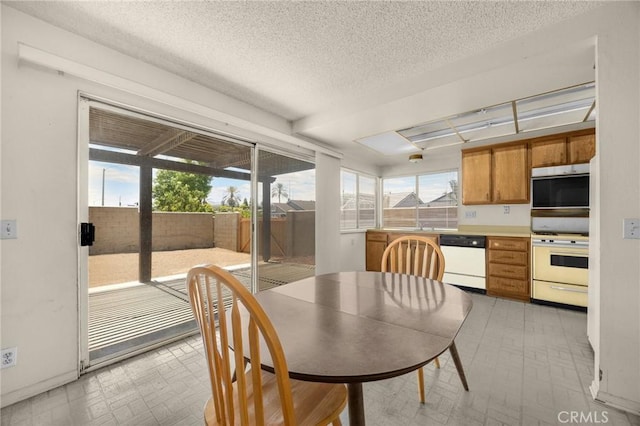 4510 E Hightree Cir, Anaheim, CA 92807 - dining area with a textured ceiling and light floors