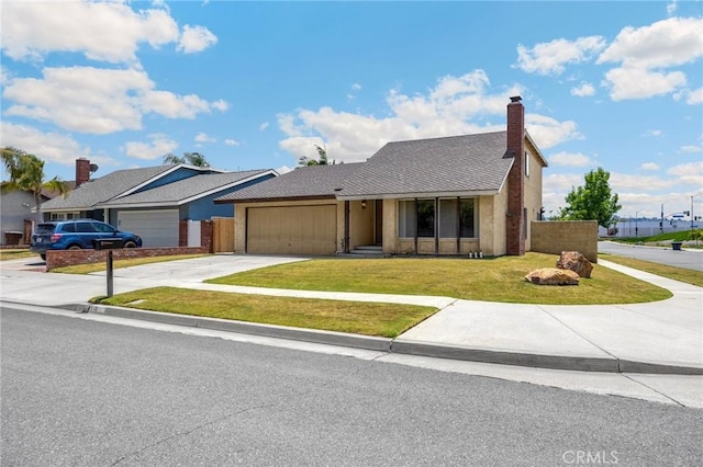 4510 E Hightree Cir, Anaheim, CA 92807 - view of front of house with a garage, driveway, and a chimney