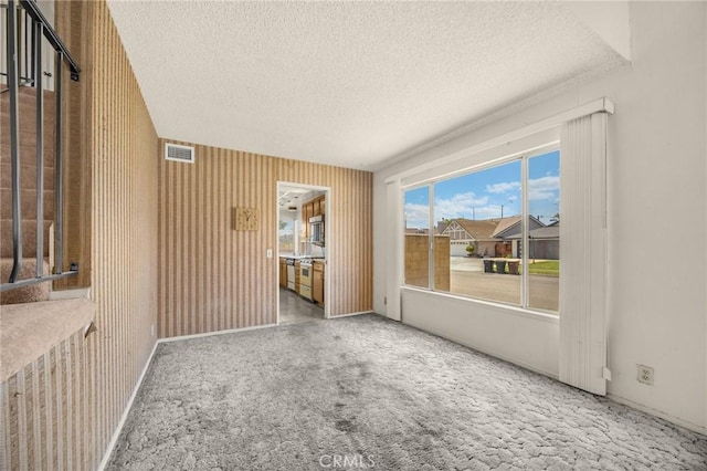 4510 E Hightree Cir, Anaheim, CA 92807 - spare room featuring a textured ceiling and carpet