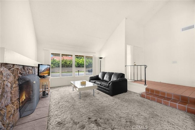 4510 E Hightree Cir, Anaheim, CA 92807 - living area with high vaulted ceiling, a stone fireplace, and carpet