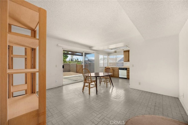 4510 E Hightree Cir, Anaheim, CA 92807 - dining room featuring brick patterned floors and a textured ceiling