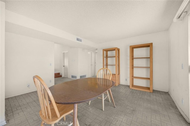 4510 E Hightree Cir, Anaheim, CA 92807 - dining area with brick patterned flooring and a textured ceiling