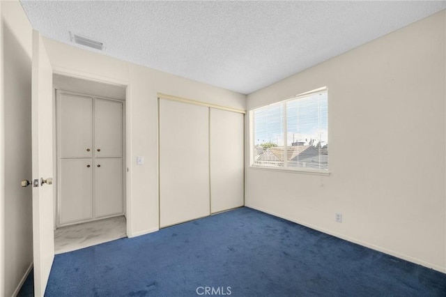 4510 E Hightree Cir, Anaheim, CA 92807 - unfurnished bedroom with carpet, a textured ceiling, and a closet