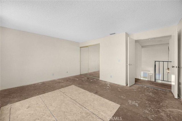 4510 E Hightree Cir, Anaheim, CA 92807 - unfurnished bedroom with a textured ceiling and a closet