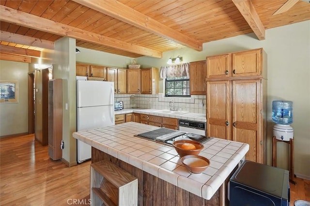 2229 Birchwood Way, Pine Mountain Club, CA 93222 - kitchen with white appliances, tile counters, a wooden ceiling with exposed beams, light wood-style floors, and backsplash