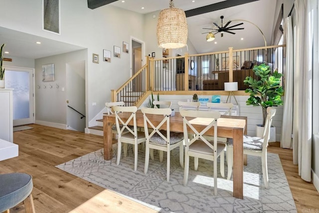 1851 Valencia Ave, Carlsbad, CA 92008 - dining area with wood finished floors, a chandelier, a high ceiling, stairway, and recessed lighting