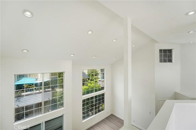 11150 Glenoaks Blvd Unit 106, Pacoima, CA 91331 - doorway to outside featuring recessed lighting and wood finished floors
