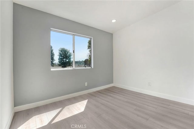 11150 Glenoaks Blvd Unit 106, Pacoima, CA 91331 - spare room with wood finished floors and recessed lighting