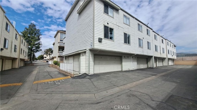 11150 Glenoaks Blvd Unit 106, Pacoima, CA 91331 - view of property with a garage