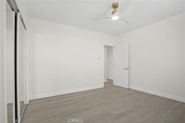 1230 Spazier Ave, Glendale, CA 91201 - unfurnished bedroom with wood finished floors, a closet, and ceiling fan