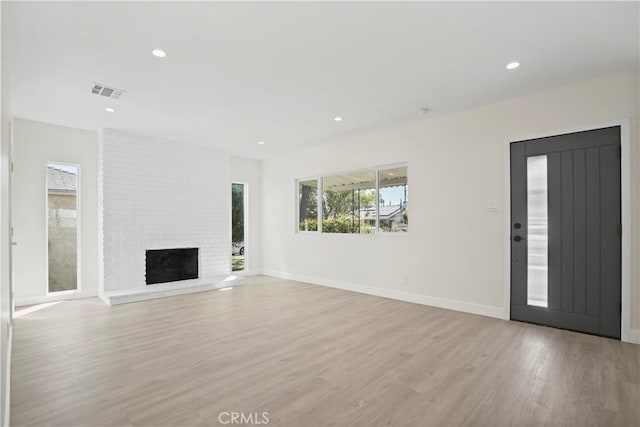 1230 Spazier Ave, Glendale, CA 91201 - unfurnished living room with light wood finished floors, a fireplace, and recessed lighting