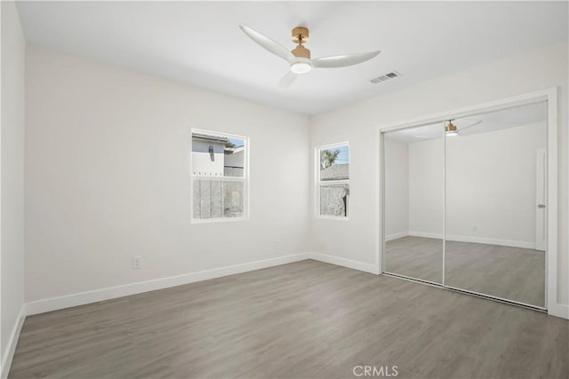 1230 Spazier Ave, Glendale, CA 91201 - unfurnished bedroom featuring wood finished floors, a closet, and a ceiling fan