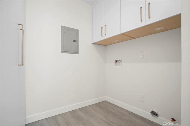 1230 Spazier Ave, Glendale, CA 91201 - washroom featuring cabinet space, electric panel, hookup for a washing machine, and light wood-style flooring