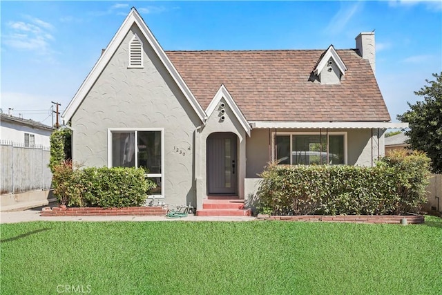 1230 Spazier Ave, Glendale, CA 91201 - english style home featuring stucco siding, a shingled roof, and a chimney