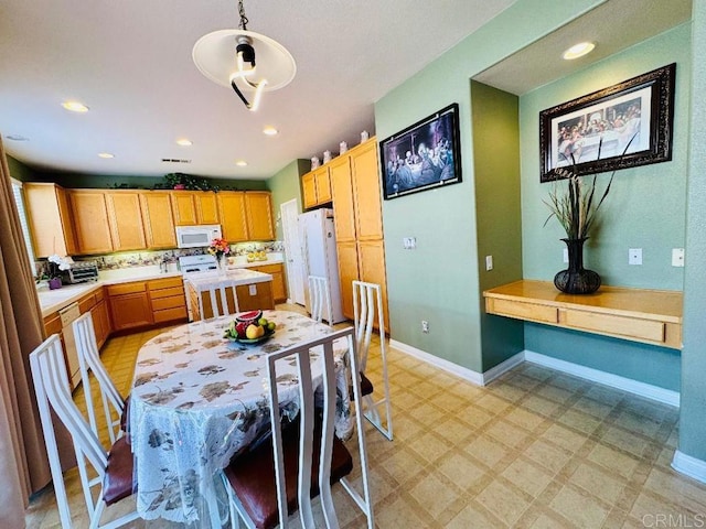 1670 Hillsborough St, Chula Vista, CA 91913 - kitchen featuring white appliances, light countertops, light floors, pendant lighting, and recessed lighting