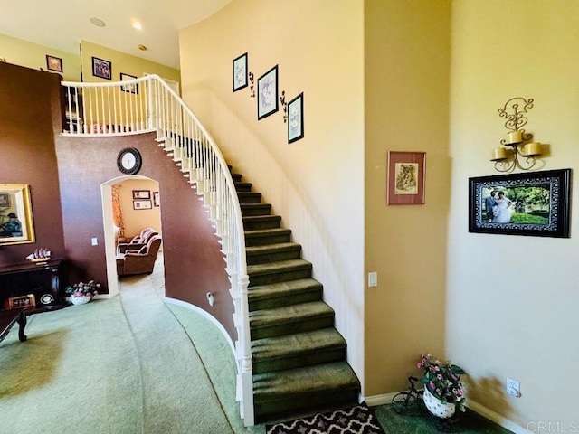 1670 Hillsborough St, Chula Vista, CA 91913 - stairs featuring arched walkways, carpet floors, and a high ceiling