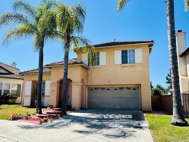 1670 Hillsborough St, Chula Vista, CA 91913 - view of front facade with stucco siding, driveway, a garage, and a tiled roof