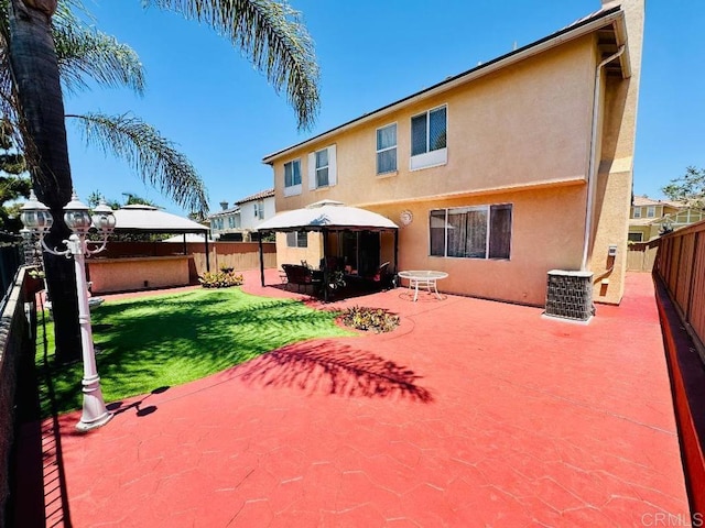 1670 Hillsborough St, Chula Vista, CA 91913 - rear view of house with a gazebo, stucco siding, a fenced backyard, and a patio