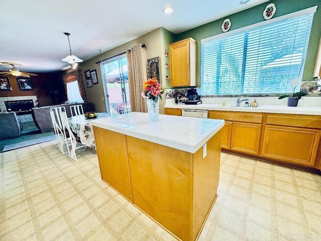 1670 Hillsborough St, Chula Vista, CA 91913 - kitchen with light floors, tile counters, pendant lighting, open floor plan, and recessed lighting