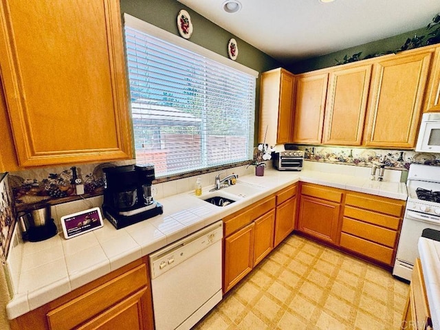 1670 Hillsborough St, Chula Vista, CA 91913 - kitchen with white appliances, light flooring, and tile counters