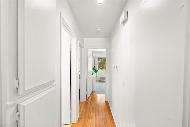 1105 W Calle De La Luna Unit 4, Azusa, CA 91702 - hall featuring light wood finished floors and baseboards