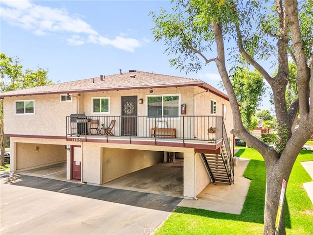 1105 W Calle De La Luna Unit 4, Azusa, CA 91702 - back of property with stairway and stucco siding