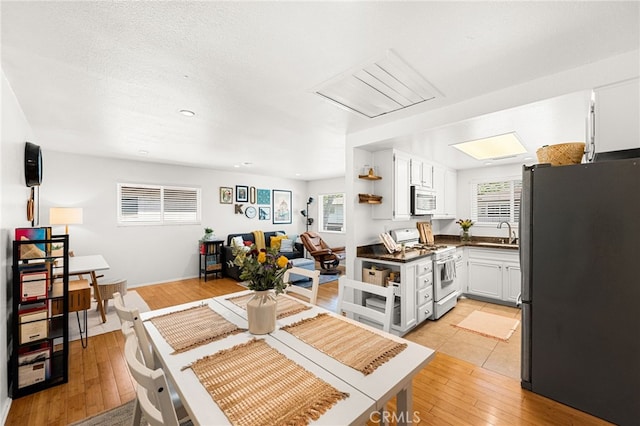 1105 W Calle De La Luna Unit 4, Azusa, CA 91702 - dining space with light wood finished floors
