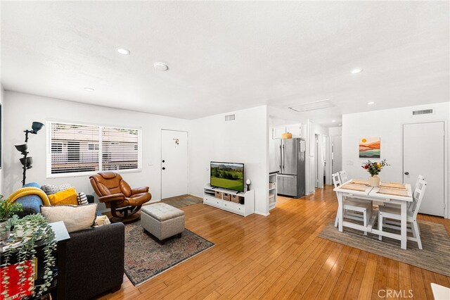 1105 W Calle De La Luna Unit 4, Azusa, CA 91702 - living area with light wood-type flooring and recessed lighting