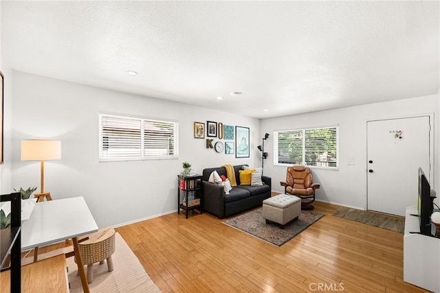 1105 W Calle De La Luna Unit 4, Azusa, CA 91702 - living area with light wood-style floors and recessed lighting