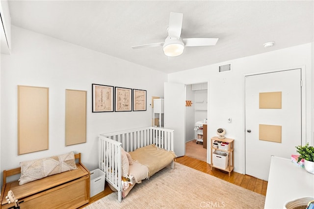 1105 W Calle De La Luna Unit 4, Azusa, CA 91702 - bedroom featuring wood finished floors and ceiling fan