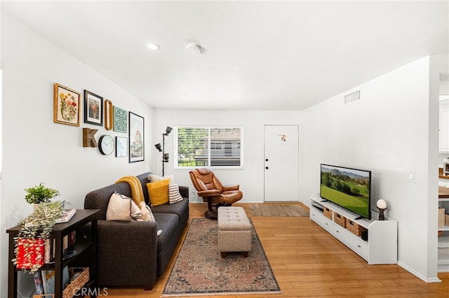 1105 W Calle De La Luna Unit 4, Azusa, CA 91702 - living room featuring light wood-style floors and recessed lighting