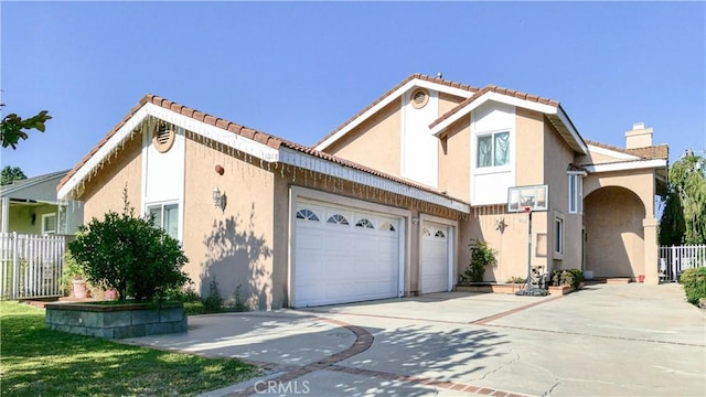 1018 Palm Ave, San Gabriel, CA 91776 - view of front of home featuring a garage, concrete driveway, stucco siding, a chimney, and a tiled roof