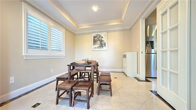 1018 Palm Ave, San Gabriel, CA 91776 - dining area with crown molding, a raised ceiling, and light marble finish flooring