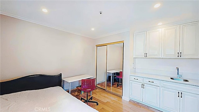 1018 Palm Ave, San Gabriel, CA 91776 - bedroom featuring light wood-style flooring, crown molding, a closet, and recessed lighting
