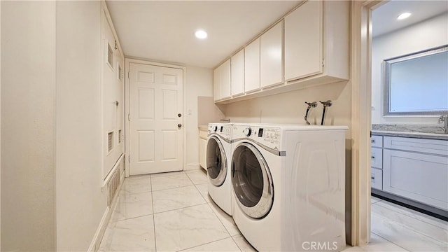 1018 Palm Ave, San Gabriel, CA 91776 - laundry area with cabinet space, washing machine and dryer, light marble finish flooring, and recessed lighting